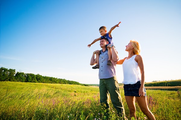 family in a green field