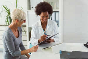 Patient reviewing chart with doctor