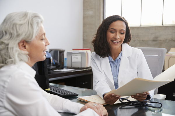 female doctor meeting with patient