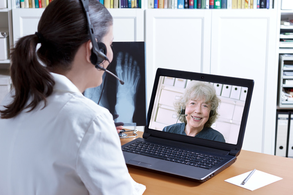 doctor talking to patient via video